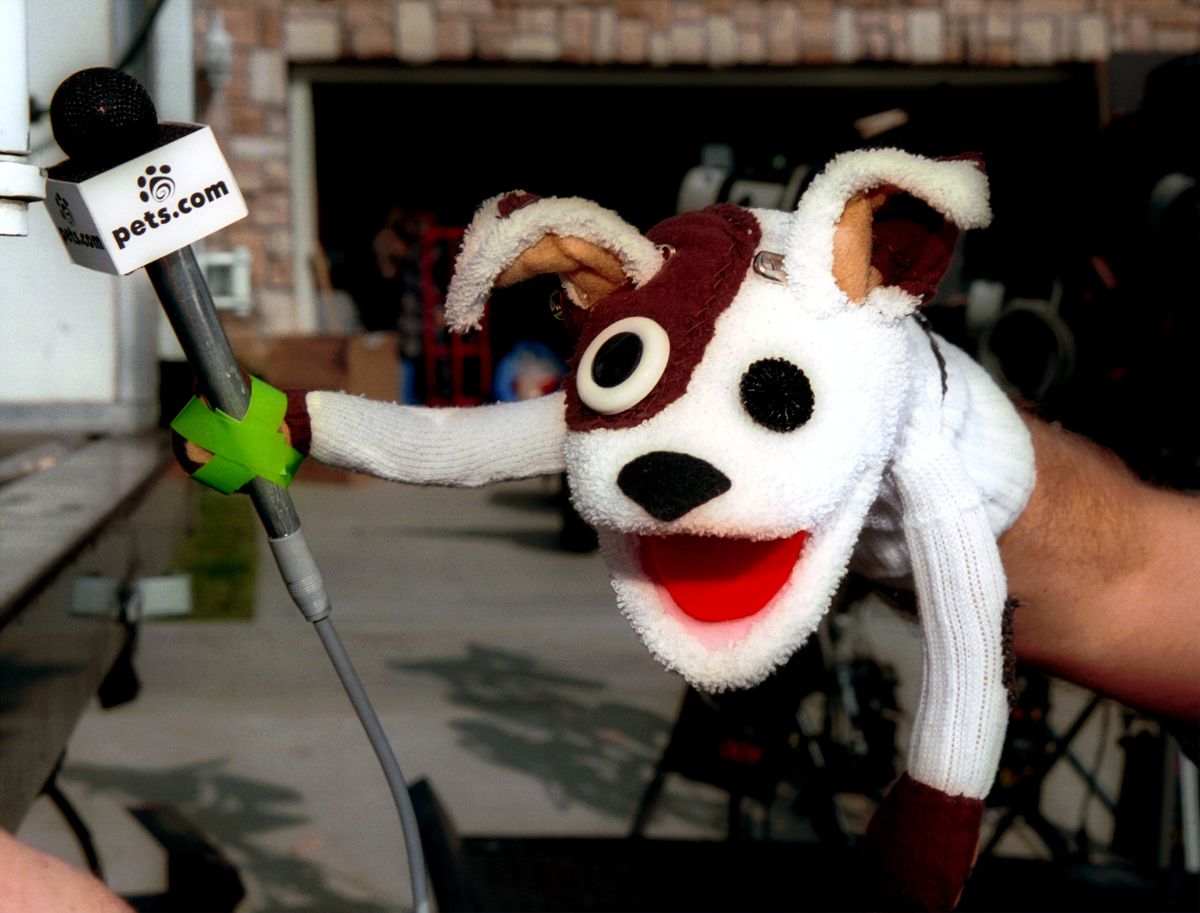 The pets.com sock puppet with a microphone taped to its paw.