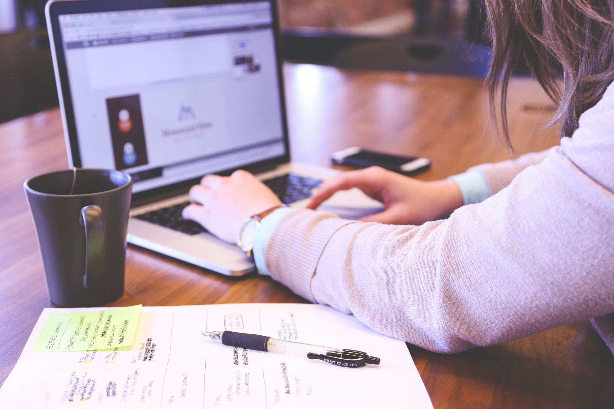 marketing automation highlight with a woman working on a laptop.